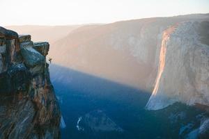 Man hanging from Taft Point photo