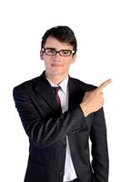 Young businessman pointing, isolated on white photo