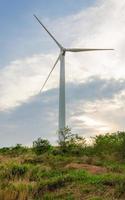 wind turbine generating electricity on hill