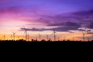 Wind turbine power generator at twilight photo