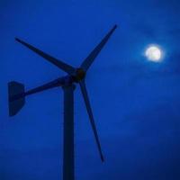 Modern wind turbine Green Energy in the moon light photo