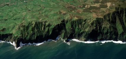 Aerial of cliff near water photo