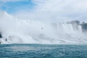 Waterfall and cloudy blue sky photo