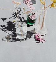 Pink flowers in clear glass vase photo