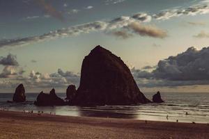 Silhouette of haystack rock on Cannon Beach photo