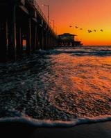 Sea waves crashing onshore photo