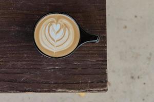 Close-up of latte on wooden table