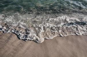 Waves on seashore photo