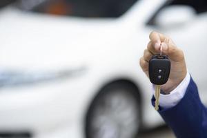 Person holding keys to car photo