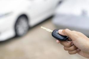 Person unlocking car photo