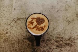 Cup of chai on concrete surface photo