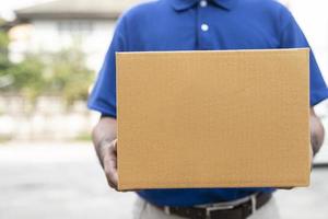 Delivery man holding box photo
