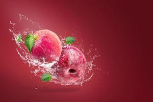 Water splashing on fresh apple  photo