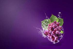 Water splashing on fresh red grapes  photo