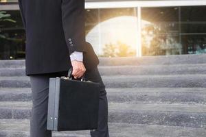 Businessman walking up the stairs  photo