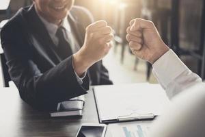 Businessmen giving fist bump  photo