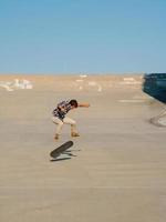 Man skateboarding outside photo