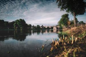 Bridge over lake during the day photo