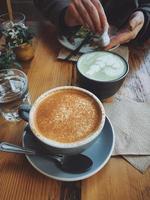 Gray and white ceramic coffee cup  photo