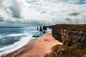 Cliffs beside body of water photo