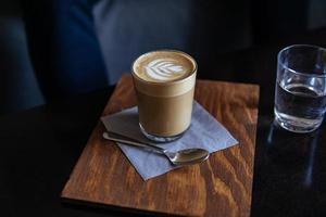 Latte in tall clear glass photo