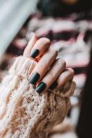 Close-up of black matte manicure photo