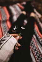 Person holding flowers photo