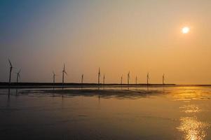 Wind turbines by the sunset photo
