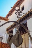 old pulley of a well in a Spanish courtyard