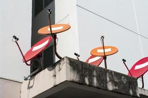 red and orange satellite dishes photo