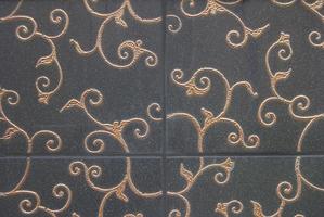 dark decorative tiles with gold floral decor