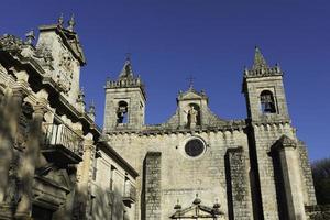 San Estevo Monastery in Ourense against a clear blue sky photo