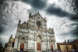 Santa Croce cathedral under a dramatic sky in Florence photo