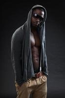Black fitness man urban style with dark sunglasses. Studio shot. photo