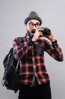 Charismatic photographer journalist in glasses and plaid shirt photo