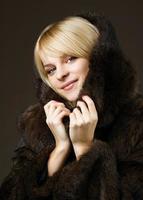 Beautiful girl in a fur coat