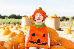 kid at pumpkin patch photo