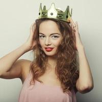 young blond woman in crown photo