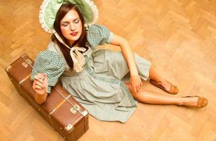 girl with suitcase in retro style