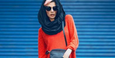 Fashion girl portrait in a stylish black headscarf and sunglasses photo