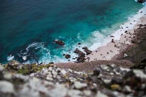 Looking down on rocky beach photo