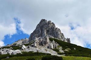 Looking up at mountain and clouds photo