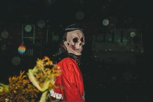 Person in skull mask photo