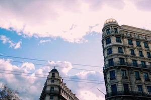 Apartment buildings under cloudy blue sky photo