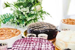 Assortment of cakes on table photo