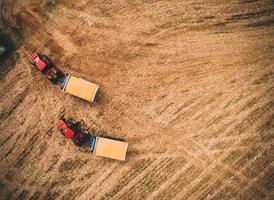 Red tractors on field photo