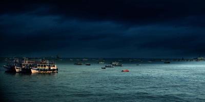 Boats on sea at night photo