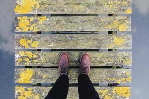 Brown leather shoes on grey and yellow bridge photo