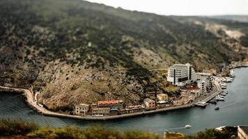 Tilt shift of village near body of water photo