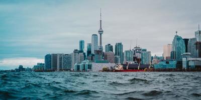 City buildings beside sea photo